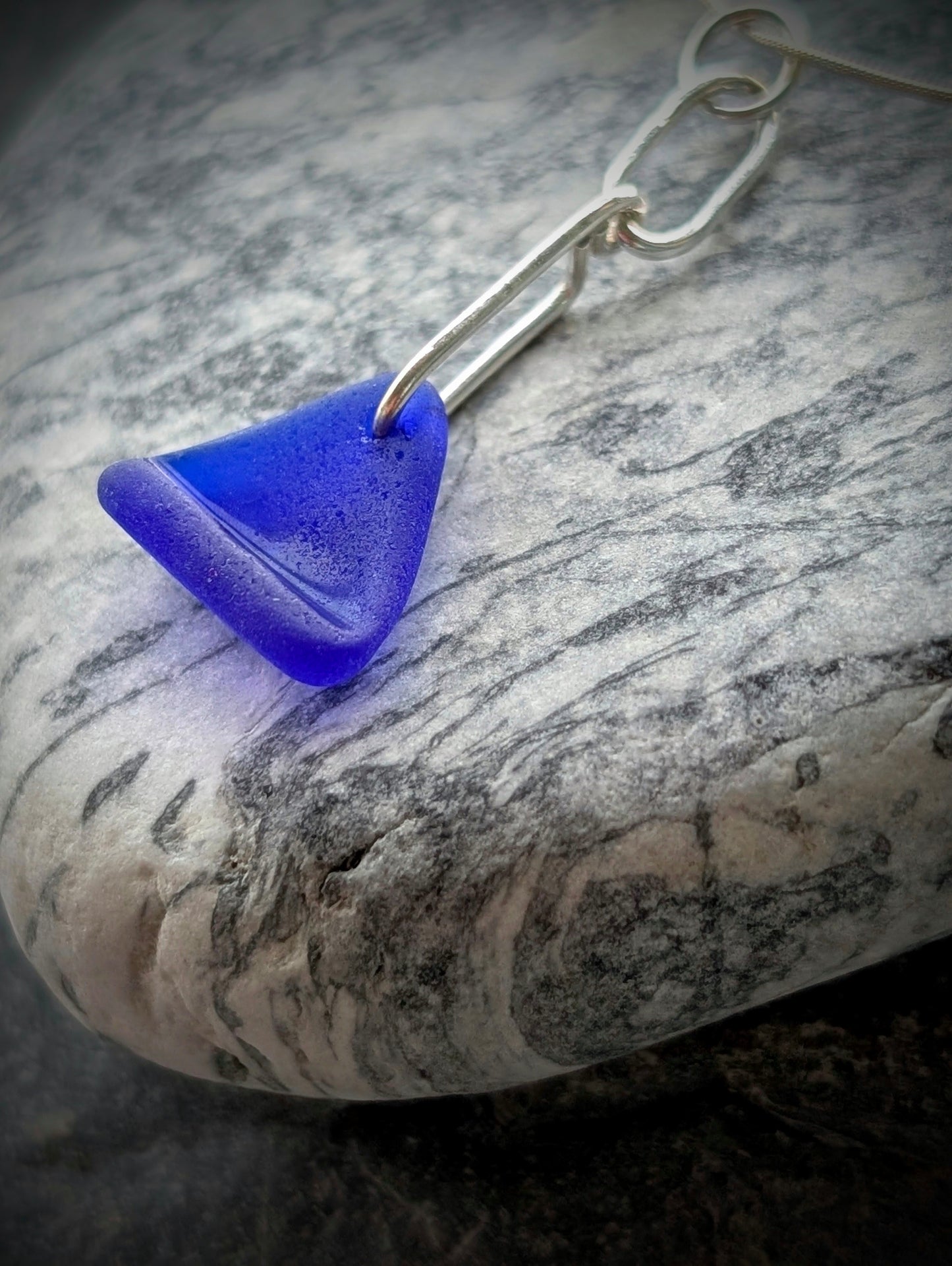 Blue Sea Glass Triangle on Hand-shaped Sterling Silver Wire