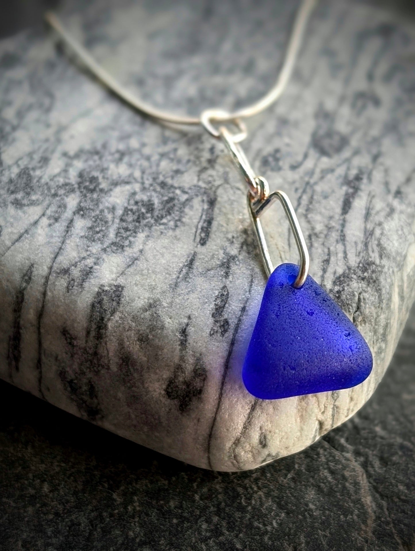 Blue Sea Glass Triangle on Hand-shaped Sterling Silver Wire