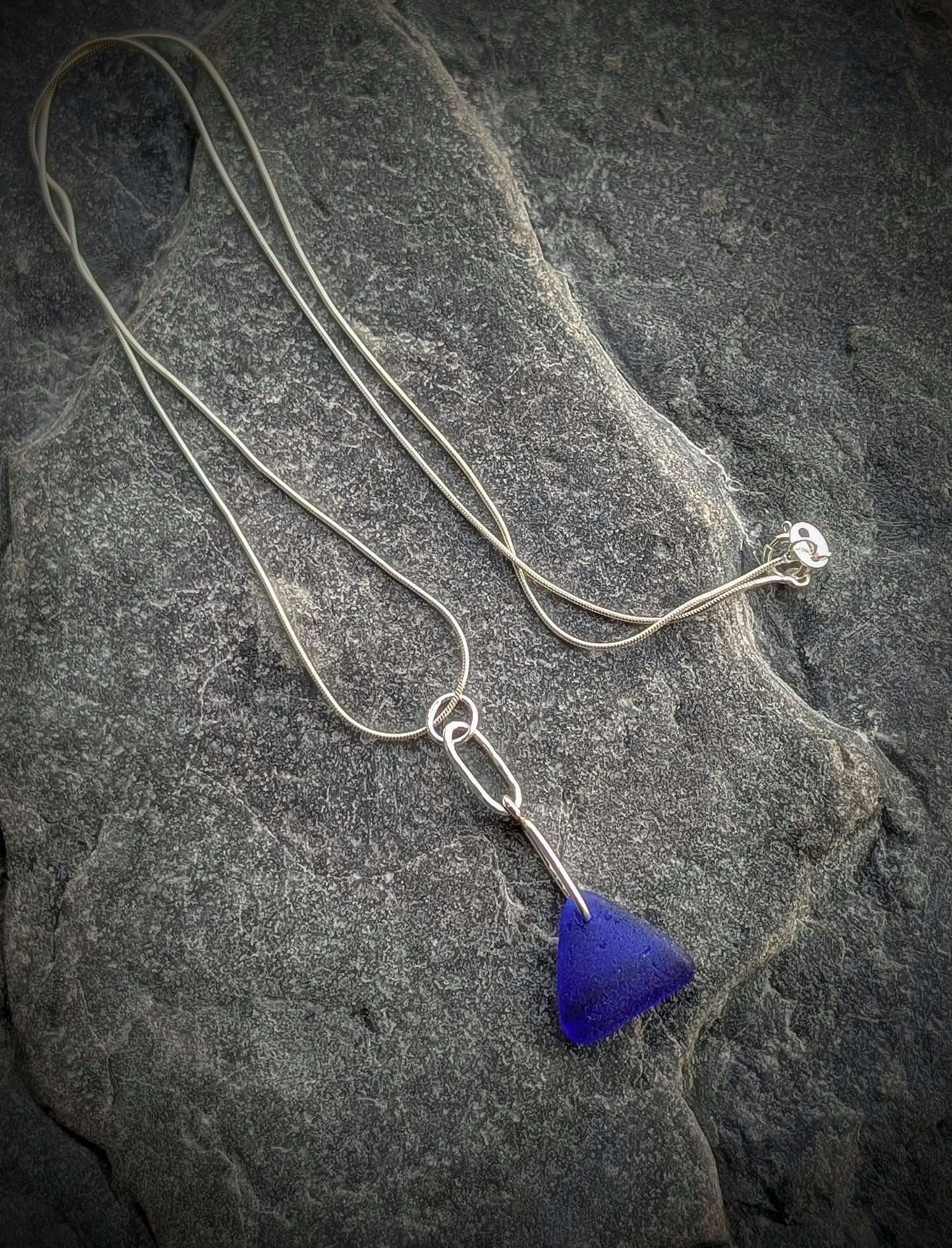 Blue Sea Glass Triangle on Hand-shaped Sterling Silver Wire