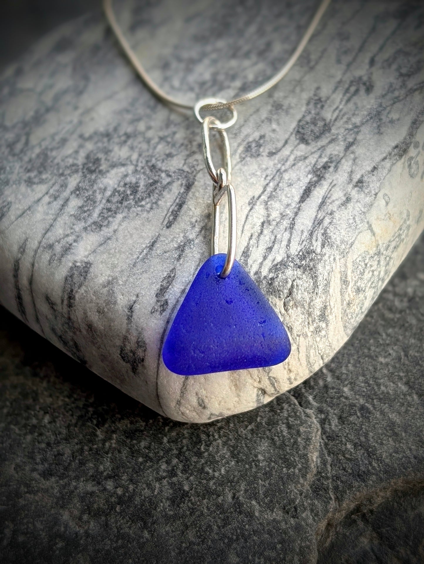 Blue Sea Glass Triangle on Hand-shaped Sterling Silver Wire