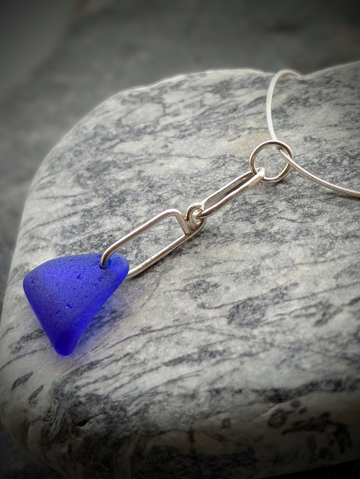 Blue Sea Glass Triangle on Hand-shaped Sterling Silver Wire