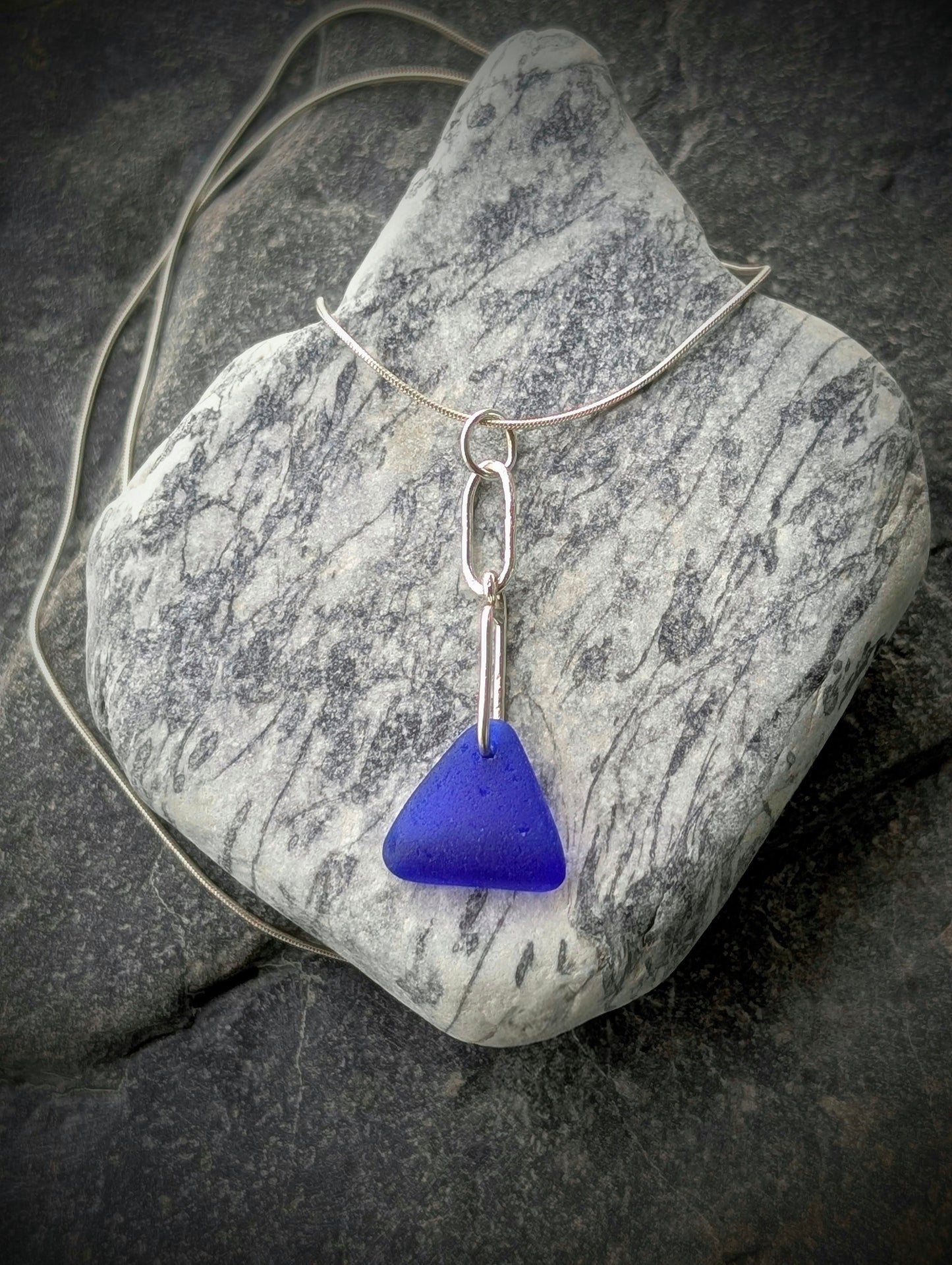Blue Sea Glass Triangle on Hand-shaped Sterling Silver Wire