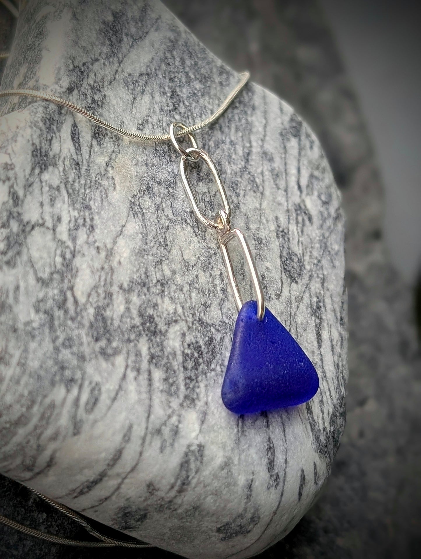 Blue Sea Glass Triangle on Hand-shaped Sterling Silver Wire